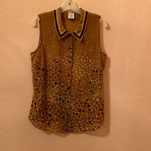 CAbi gold tone blouse with ribbon trim on collar.